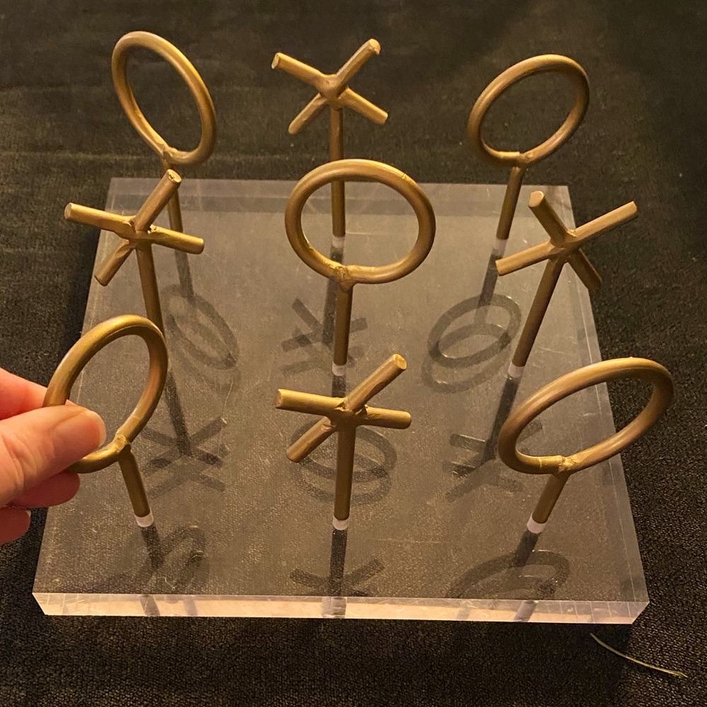 Glass tic-tac-toe board. Gold Xs snd Os screw out. Great for a table display!